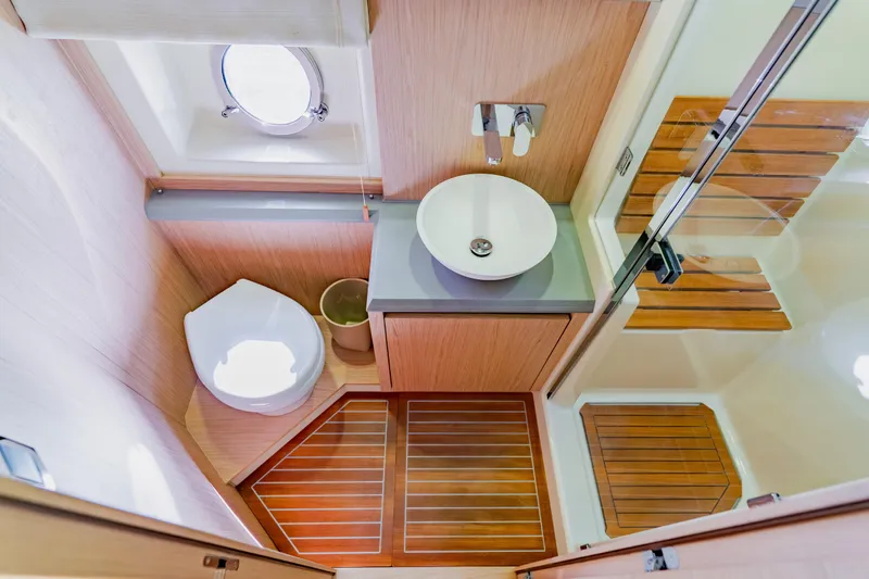 Slide: The Image of Luxurious bathroom in 2015 Monte Carlo MC5 yacht with modern fixtures and wooden accents. - 36