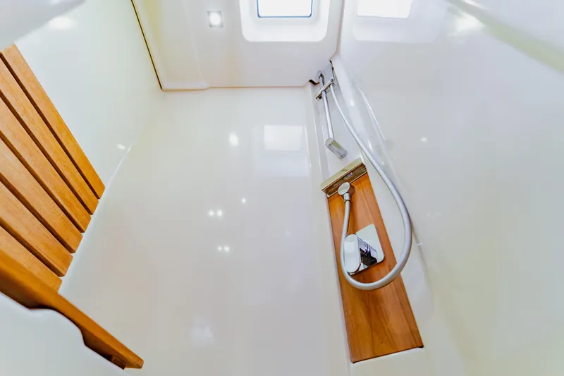 Slide: The Image of Luxurious shower area in 2015 Monte Carlo MC5 yacht with wooden accents and modern fixtures. - 40