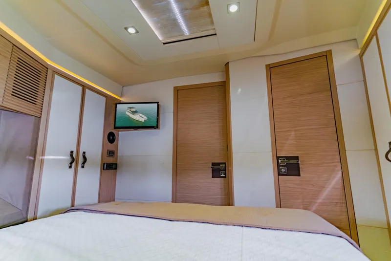 Slide: The Image of Luxurious interior of 2015 Monte Carlo MC5 yacht cabin with modern design and TV. - 50