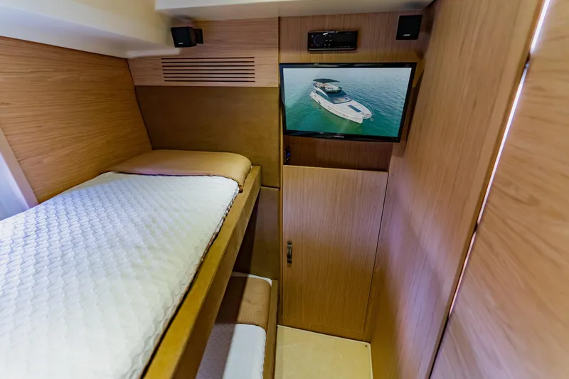 Slide: The Image of Cozy cabin interior of 2015 Monte Carlo MC5 yacht with bunk beds and TV. - 54