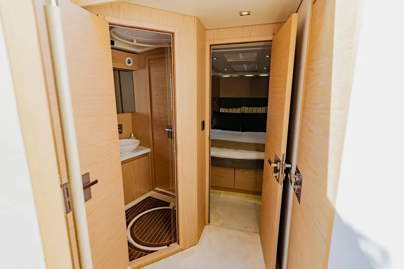 Slide: The Image of Luxurious interior of 2015 Monte Carlo MC5 yacht featuring bedroom and bathroom. - 55