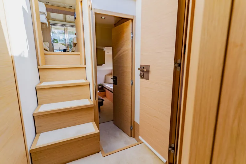 Slide: The Image of Interior of 2015 Monte Carlo MC5 yacht, featuring wooden stairs and modern design. - 56