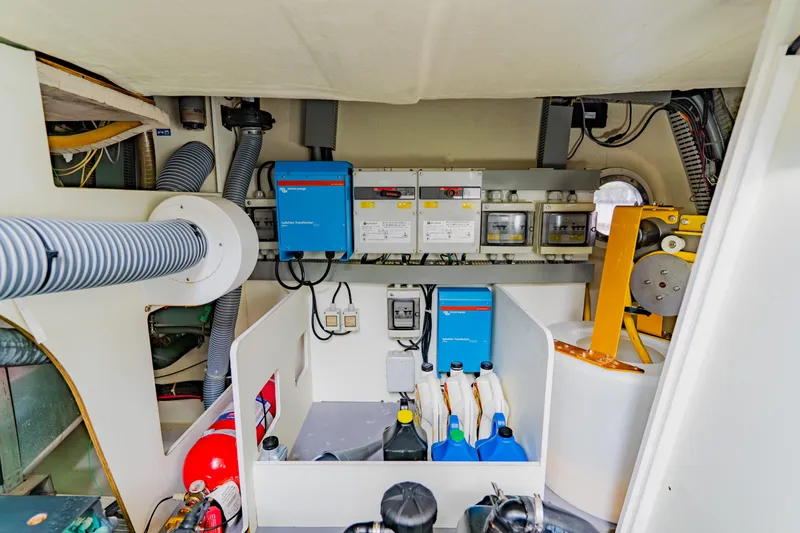 Slide: The Image of Engine room of 2015 Monte Carlo MC5 yacht with equipment and storage. - 64