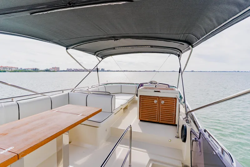 Slide: The Image of Luxurious 2015 Monte Carlo MC5 yacht interior with seating and table on open water. - 70