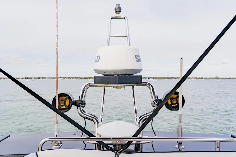Slide: The Image of 2015 Monte Carlo MC5 yacht radar and antenna system on open water. - 79