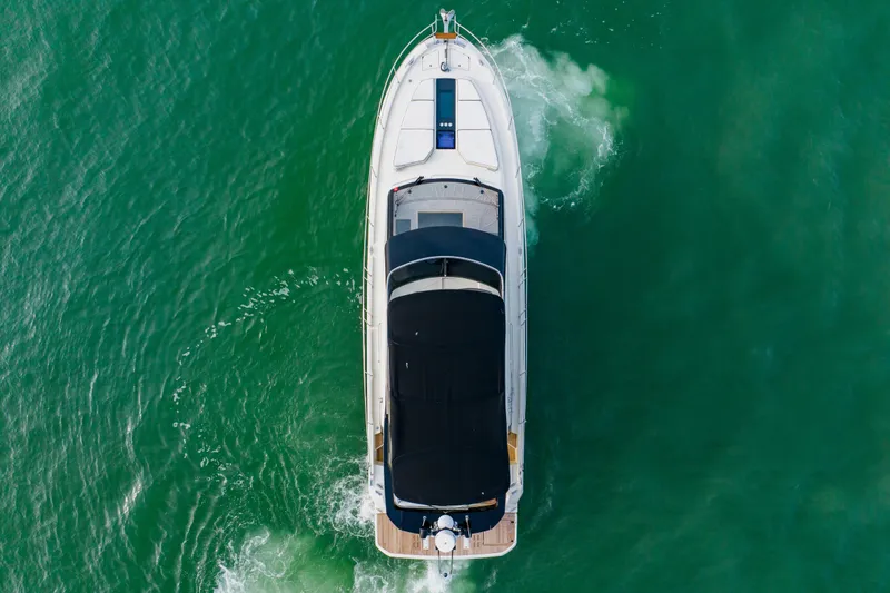 Slide: The Image of Aerial view of 2015 Monte Carlo MC5 yacht cruising on green water. - 9