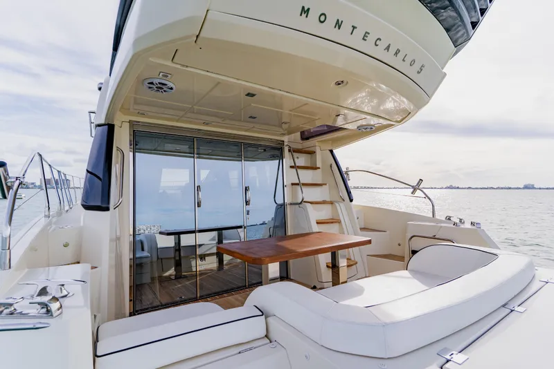 Slide: The Image of Luxurious 2015 Monte Carlo MC5 yacht with elegant seating and ocean view. - 16