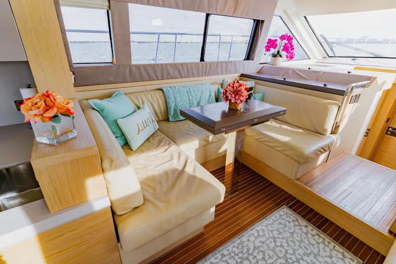Slide: The Image of Luxurious Monte Carlo MC5 2015 yacht interior with elegant seating and floral decor. - 18