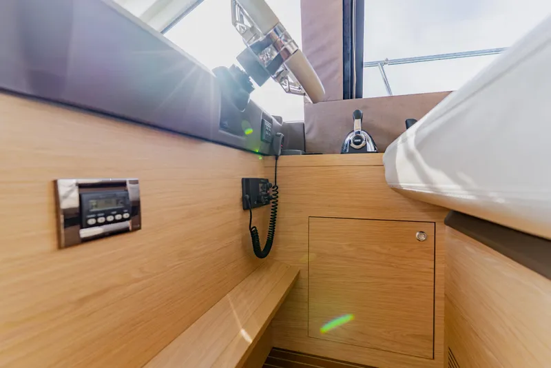 Slide: The Image of Interior of 2015 Monte Carlo MC5 yacht, featuring modern controls and wooden finish. - 25