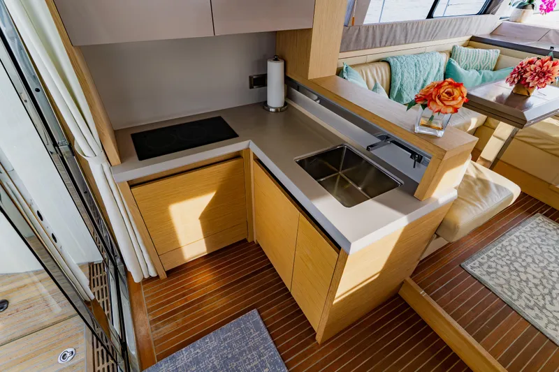 Slide: The Image of Luxurious Monte Carlo MC5 2015 yacht interior with modern kitchen and elegant seating area. - 28
