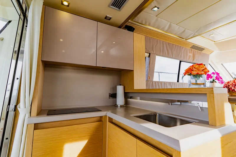 Slide: The Image of Luxurious kitchen interior of 2015 Monte Carlo MC5 yacht with modern design and floral decor. - 29