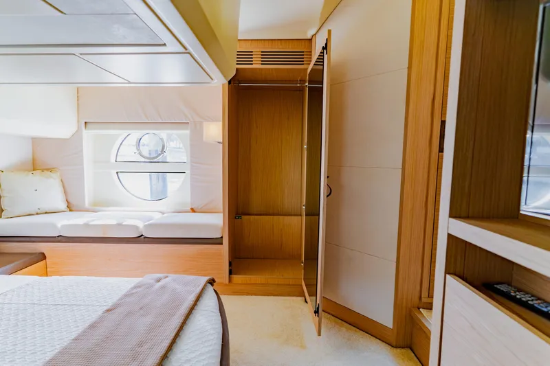 Slide: The Image of Luxurious interior of 2015 Monte Carlo MC5 yacht with elegant wood finishes and cozy seating. - 33