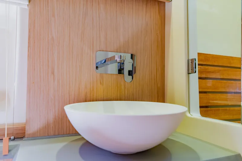Slide: The Image of Modern bathroom sink in 2015 Monte Carlo MC5 yacht, featuring sleek design and wood accents. - 38