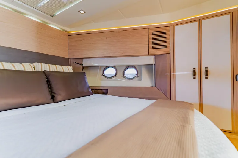 Slide: The Image of Luxurious interior cabin of 2015 Monte Carlo MC5 yacht with elegant bedding and porthole. - 45
