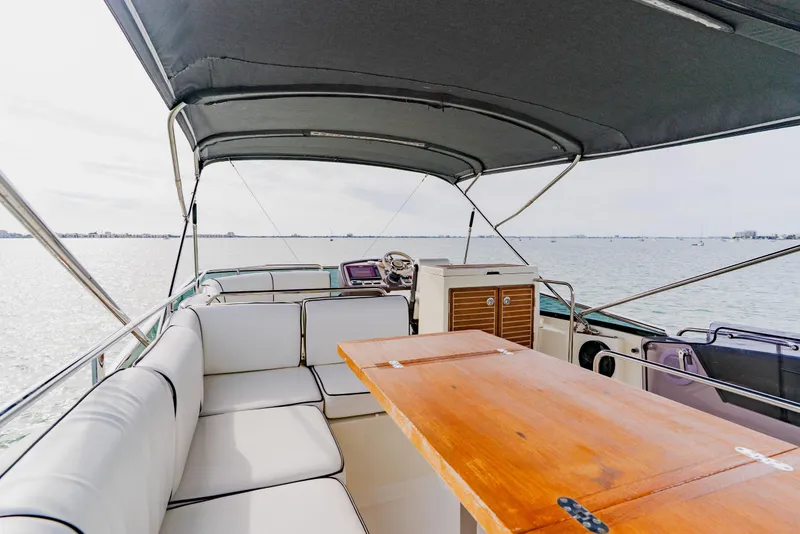 Slide: The Image of Luxury Monte Carlo MC5 yacht interior with seating and table, 2015 model, on open water. - 71