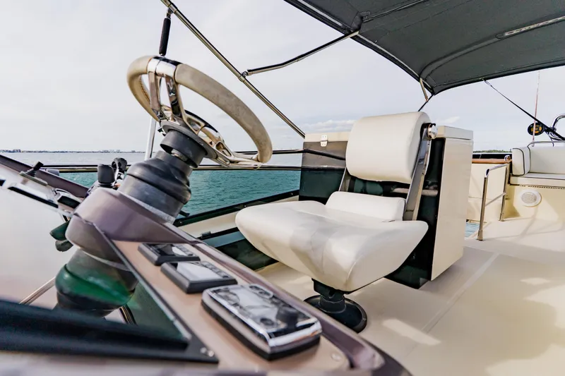 Slide: The Image of Helm of 2015 Monte Carlo MC5 yacht with steering wheel and captain's chair. - 76