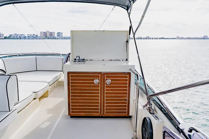 Slide: The Image of Luxury Monte Carlo MC5 yacht interior with seating and kitchenette, 2015 model, on open water. - 81