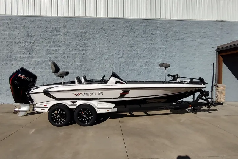 The Image of 2026 Vexus VXs21 boat on trailer, parked outdoors, side view. - 1