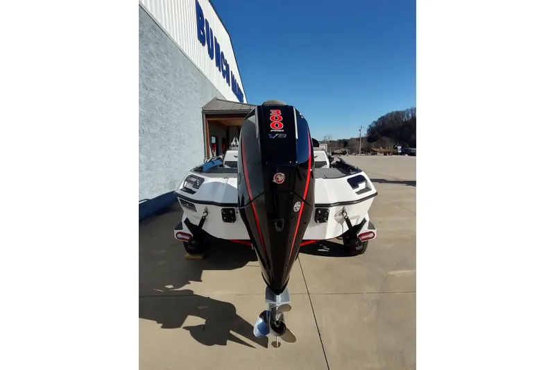 Slide: The Image of 2026 Vexus VXs21 boat with powerful outboard motor, parked outdoors on a sunny day. - 4