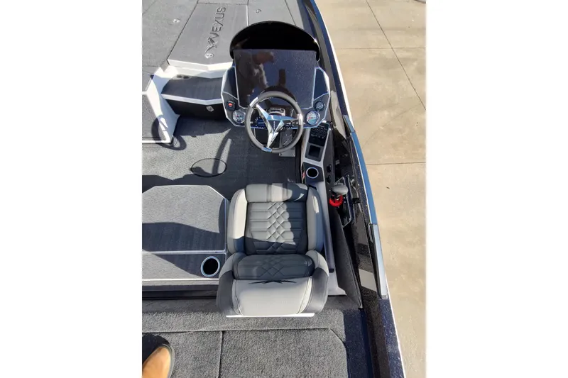 Slide: The Image of 2026 Vexus VXs21 boat cockpit with steering wheel and cushioned seat. - 6