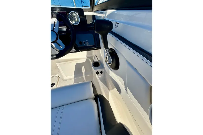 Slide: The Image of Interior view of 2018 Sea Ray SPX 190 Outboard boat cockpit and controls. - 14