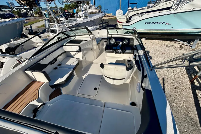 Slide: The Image of 2018 Sea Ray SPX 190 Outboard boat interior with seating and steering console. - 15