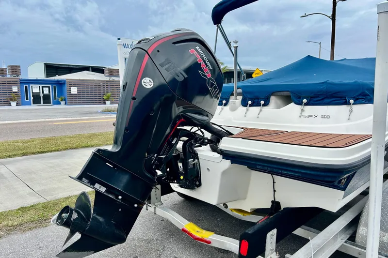 Slide: The Image of 2018 Sea Ray SPX 190 Outboard boat with Mercury engine, parked on trailer. - 4