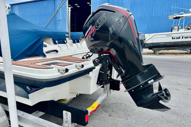 Slide: The Image of 2018 Sea Ray SPX 190 Outboard with Mercury Pro XS engine, docked and covered. - 5
