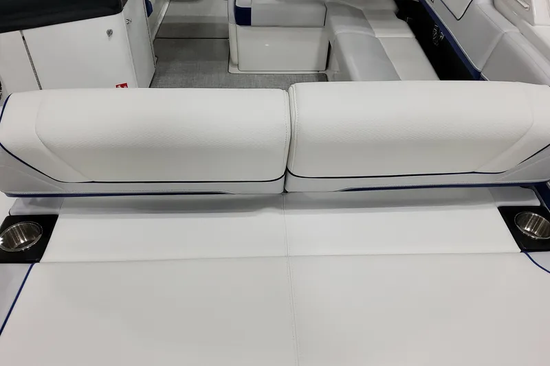 Slide: The Image of 2026 Formula 310 Bowrider I/O interior with white seating and cup holders. - 15