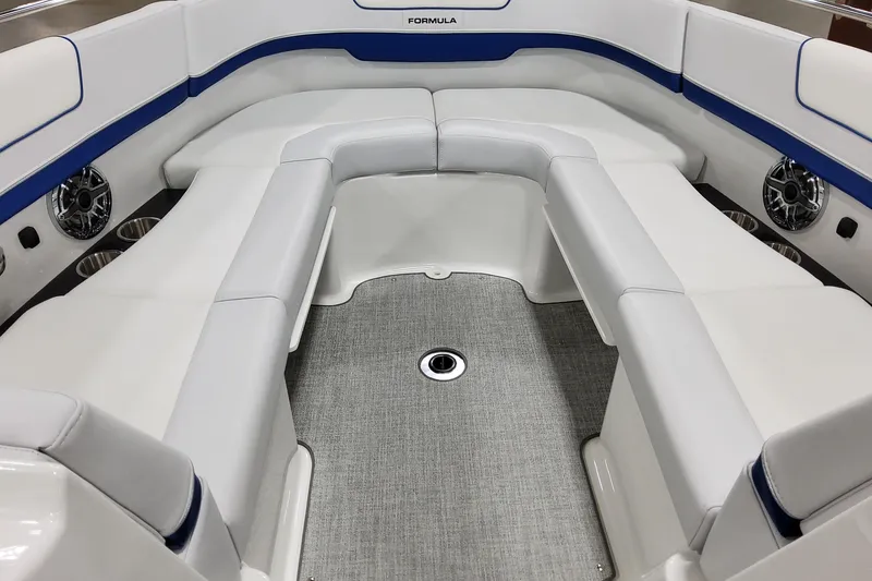 Slide: The Image of 2026 Formula 310 Bowrider I/O interior with white seating and blue accents. - 19