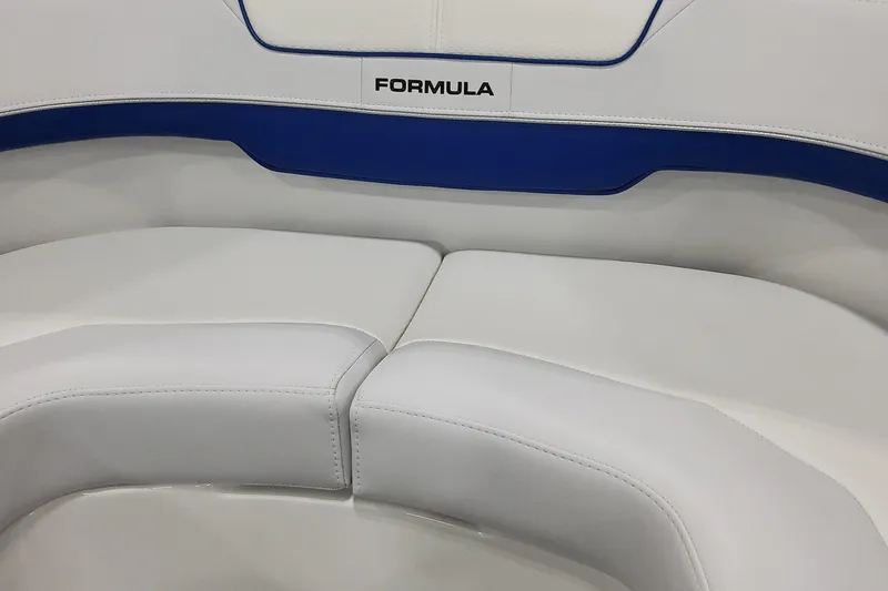 Slide: The Image of 2026 Formula 310 Bowrider I/O boat seating with white and blue upholstery. - 25