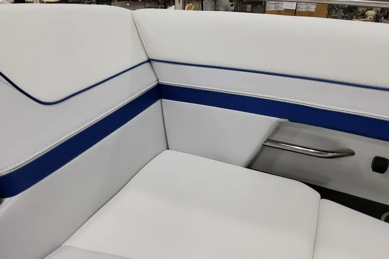 Slide: The Image of 2026 Formula 310 Bowrider I/O interior with white and blue seating detail. - 28