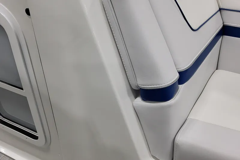 Slide: The Image of 2026 Formula 310 Bowrider I/O interior, featuring sleek white and blue seating design. - 29