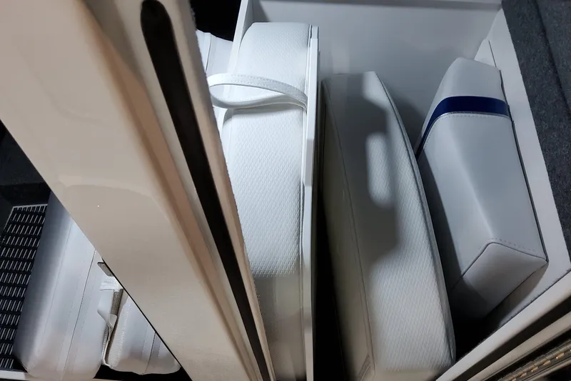 Slide: The Image of 2026 Formula 310 Bowrider I/O interior storage with white cushioned seats. - 37