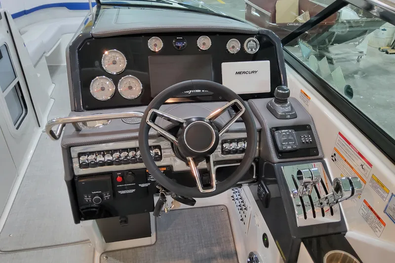 Slide: The Image of 2026 Formula 310 Bowrider I/O dashboard with steering wheel and control panel. - 40