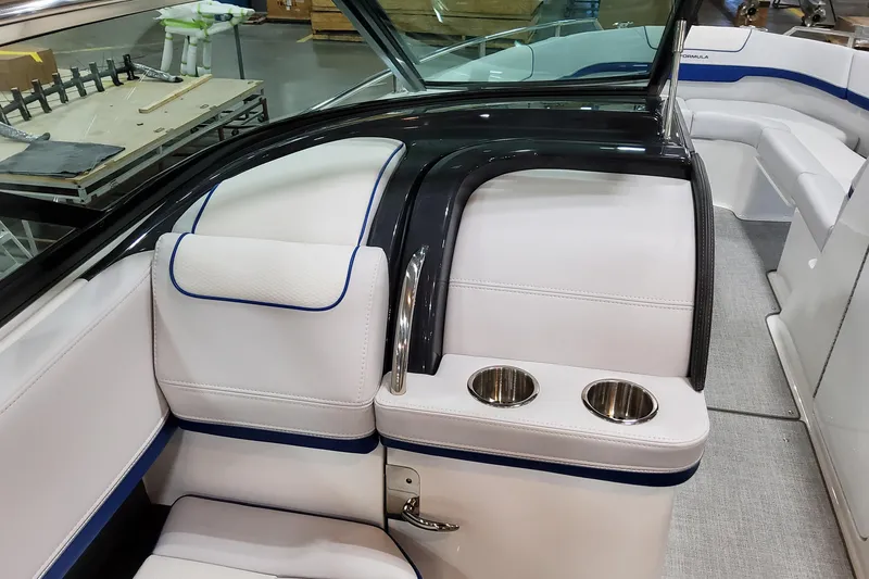 Slide: The Image of 2026 Formula 310 Bowrider I/O interior with white seating and cup holders. - 43