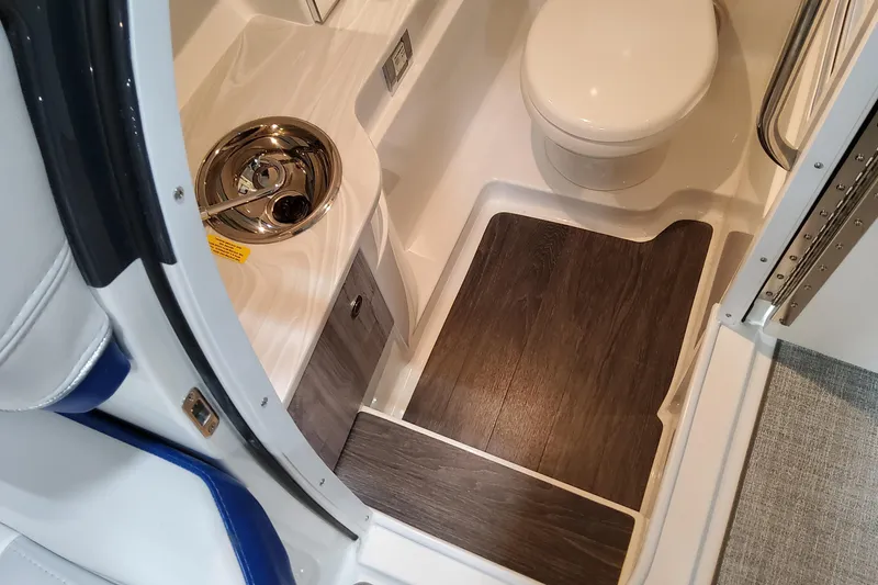 Slide: The Image of Interior of 2026 Formula 310 Bowrider I/O boat bathroom with sink and toilet. - 44