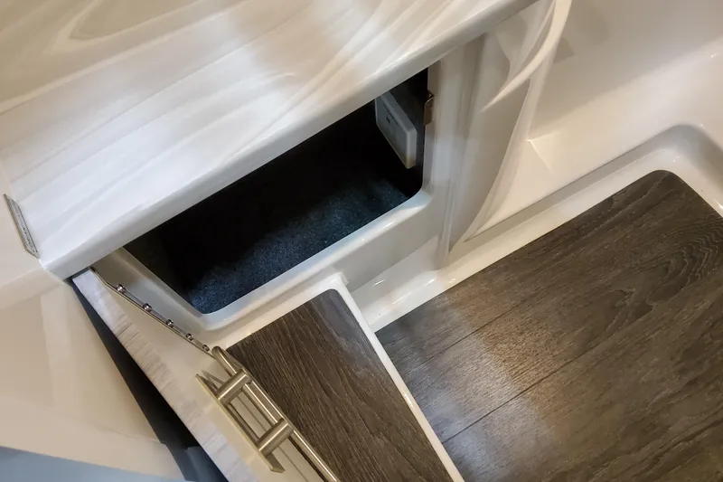 Slide: The Image of Interior storage compartment of 2026 Formula 310 Bowrider I/O with wood flooring. - 46
