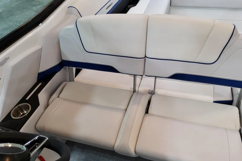 Slide: The Image of 2026 Formula 310 Bowrider I/O interior with sleek white and blue seating design. - 48