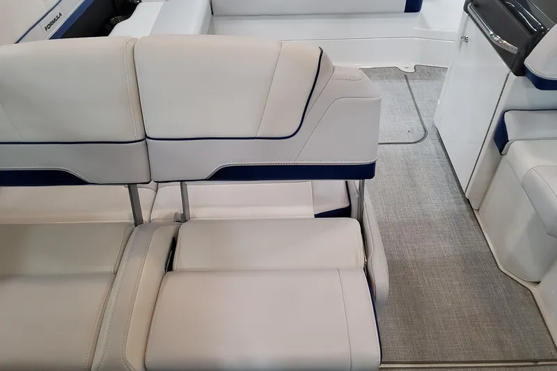 Slide: The Image of 2026 Formula 310 Bowrider I/O interior with luxurious white seating and modern design. - 49