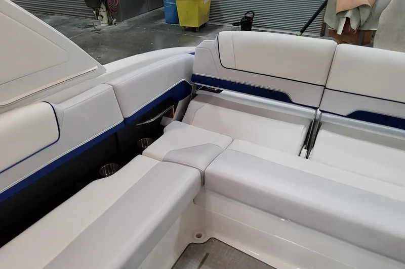 Slide: The Image of Luxurious seating in 2026 Formula 310 Bowrider I/O boat, featuring sleek white upholstery. - 55