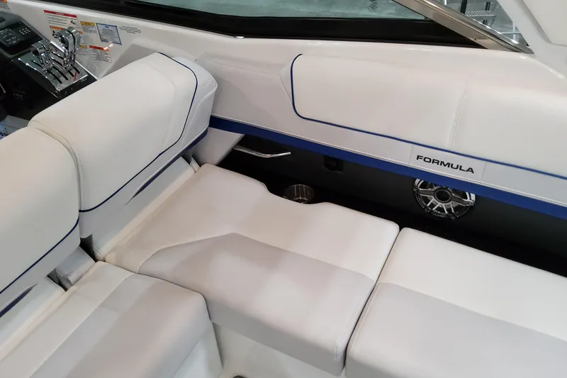 Slide: The Image of 2026 Formula 310 Bowrider I/O interior with white seating and sleek design. - 57