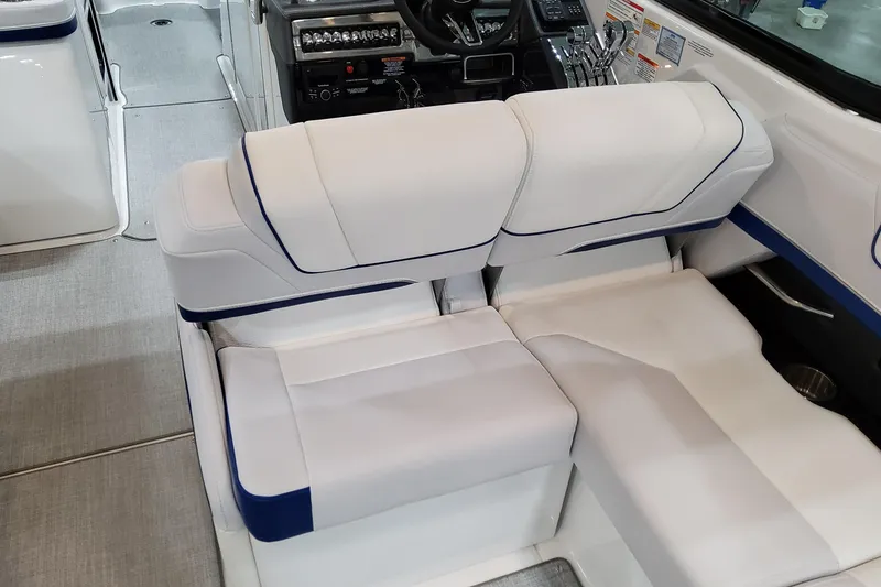 Slide: The Image of 2026 Formula 310 Bowrider I/O interior with white and blue seating, modern dashboard. - 58