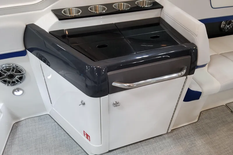 Slide: The Image of Interior of 2026 Formula 310 Bowrider I/O boat with sleek seating and cup holders. - 61