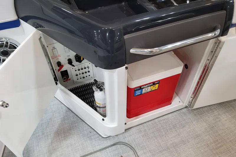 Slide: The Image of 2026 Formula 310 Bowrider I/O interior with storage, cooler, and fire extinguisher. - 63