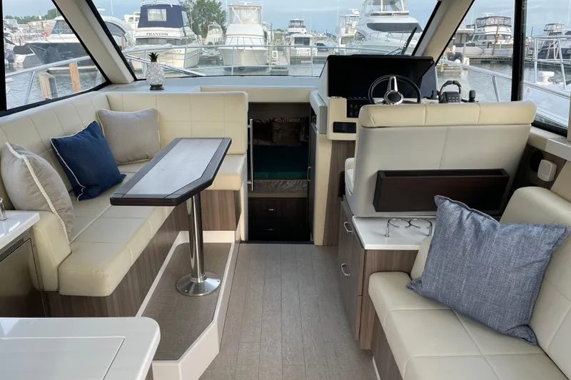 Slide: The Image of Interior of 2022 Regal 38 Grande Coupe yacht with modern kitchen and seating area. - 11