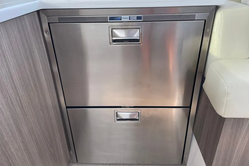 Slide: The Image of Luxurious interior of 2022 Regal 38 Grande Coupe with cozy bed and modern TV setup. - 15