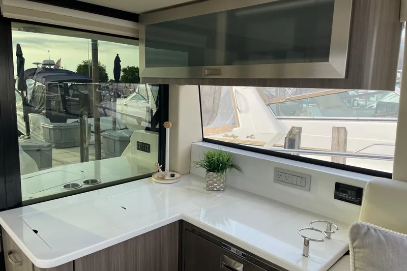 Slide: The Image of Manufacturer Provided Image: Luxurious interior of 2022 Regal 38 Grande Coupe yacht with modern furnishings. - 17