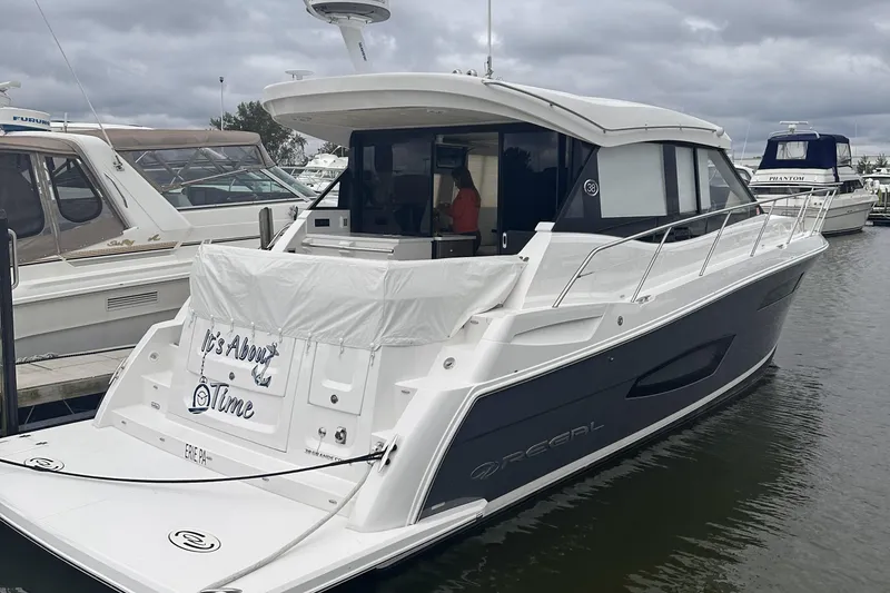 Slide: The Image of Luxurious interior of 2022 Regal 38 Grande Coupe yacht with plush seating and modern helm. - 2