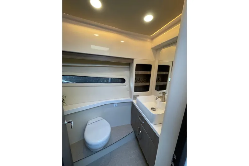 Slide: The Image of Manufacturer Provided Image: Modern kitchen area on a 2022 Regal 38 Grande Coupe yacht with sleek countertops. - 26